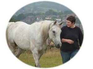 Helen Jackson of Develop your Horse walking with a joined-up horse in Belper Derbyshire